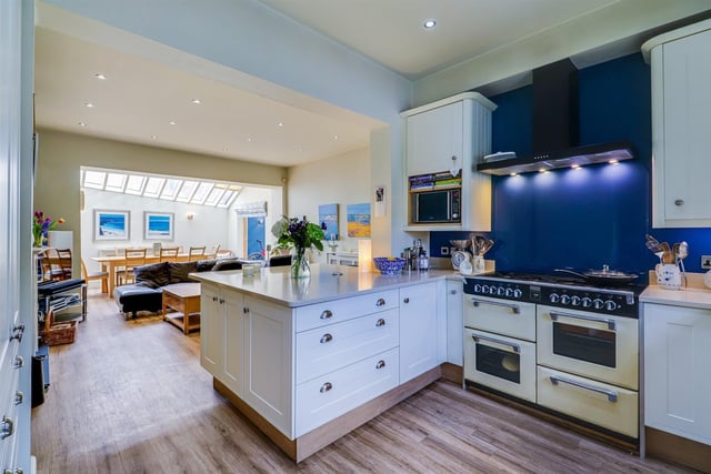 The impressive open plan kitchen with sitting and dining areas.