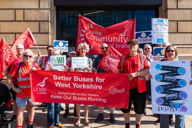 Bus passengers and union members at the launch of the campaign
