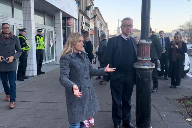 Kim Leadbeater MP shows Michael Gove around Batley town centre on December 15, 2022.