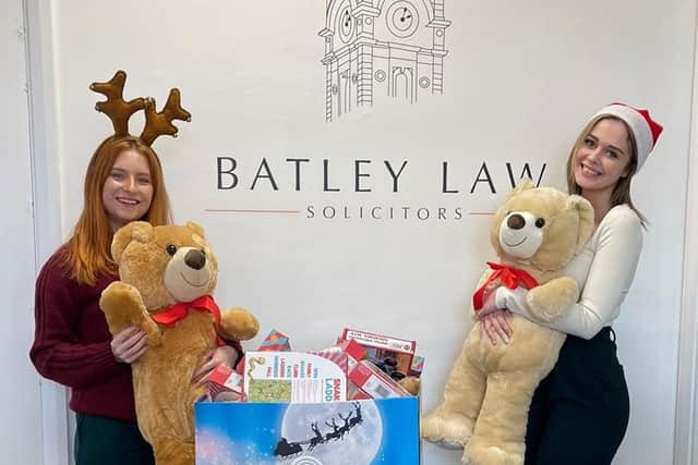 Hollie Auty, left, and Jennifer Fitos at Batley Law with the stash of brand new toys waiting to hand them over to the Cash For Kids charity