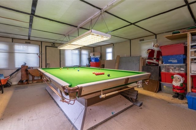 An outbuilding is handy as a games room, but could be developed as a gym, a home office or alternative use.