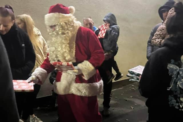 Santa handing out presents at last year's trail