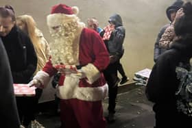 Santa handing out presents at last year's trail