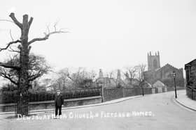 A view of St John’s Church and the Fletcher Homes in Boothroyd Lane, both of which are still standing, Cow Nest Park is just over the wall.