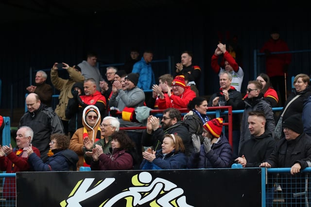 Dewsbury Rams fans support their team after making the long travel to Workington.