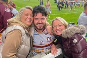 Kay Sheldon, left, whose business K&M Metals Ltd sponsors Batley Bulldogs, celebrates the clubs' Championship play-off semi-final win at Featherstone Rovers with front-rower Martyn Reilly and her daughter, Anna.