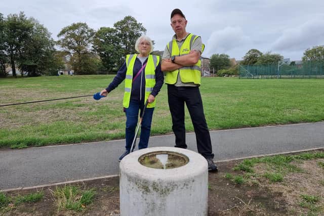 Chair of Staincliffe Park Volunteers Stevan Morton (right), with treasurer Pat, at the park following the theft of six treasured heritage plaques.
