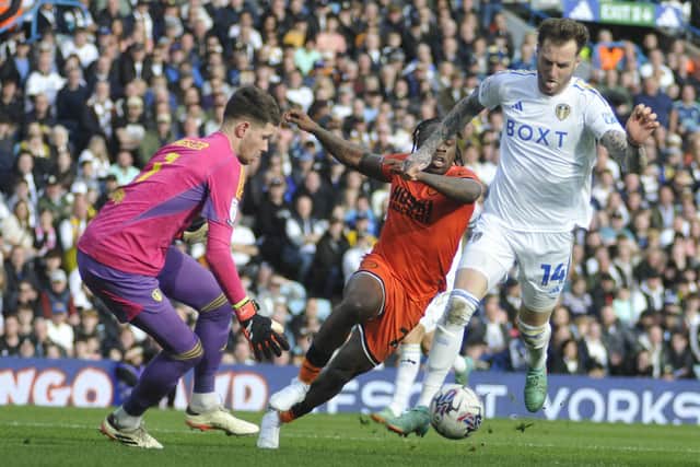 Joe Rodon clears danger at the back for Leeds United.