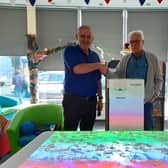 Kevin Riley, Customer Care at OMI, left, and Stephen Walker, Chair of Friends of Birstall Library with the Mobii system.