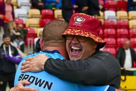 Batley Bulldogs head coach Craig Lingard hugs captain James Brown after the 1895 Cup semi-final victory at York Knights. (Photo credit: Paul Butterfield)
