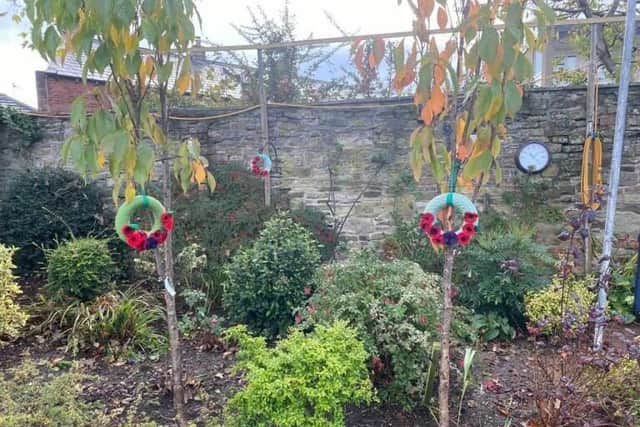 The knitted wreathes in Jubilee Garden.