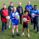 Volunteers and EBSCA board members celebrate securing the ground-breaking funding with players Mary Turping (recently signed to Leeds Rhinos) and Gomersal and Cleckheaton football club player Lincoln Fagborun