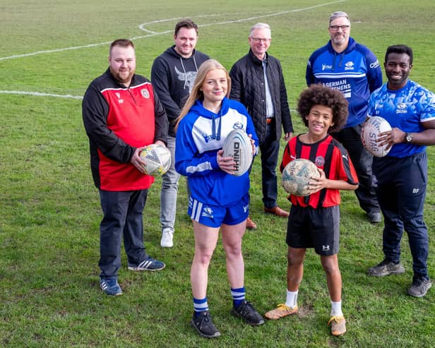 Volunteers and EBSCA board members celebrate securing the ground-breaking funding with players Mary Turping (recently signed to Leeds Rhinos) and Gomersal and Cleckheaton football club player Lincoln Fagborun