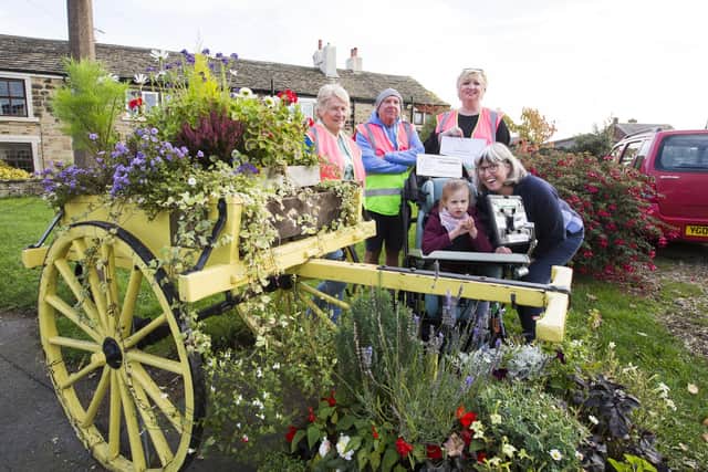 Roberttown in Bloom volunteers Sue Harris, Pete Childe, Louise Hardy, Lucy Holmes and Joanna Holmes.