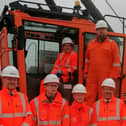 Rail Minister Huw Merriman, TRU managing director Neil Holm and Dewsbury MP Mark Eastwood with apprentices from the project's site in Ravensthorpe
