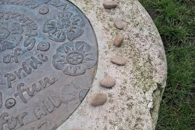One of the plaques which has been stolen from the park.