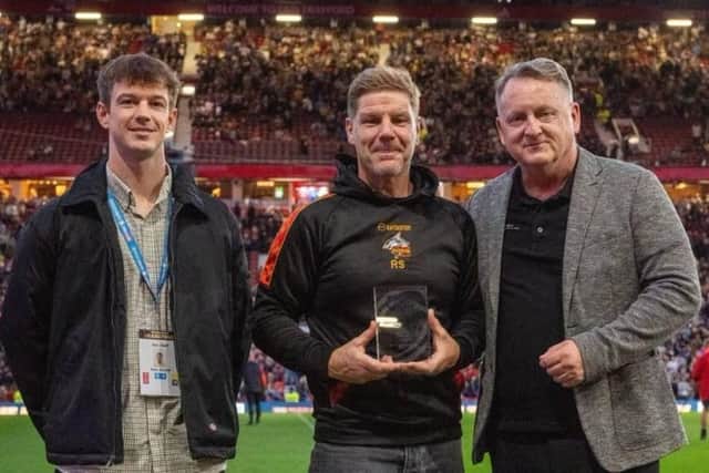 Shaw Cross Sharks chairman Richard Stephenson receives the Community Club of the Year award at Old Trafford.