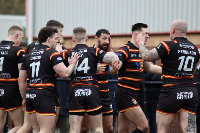 Lewis Carr is congratulated by teammates on his try for Dewsbury Rams.