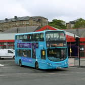 An Arriva bus leaves Dewsbury Bus Station