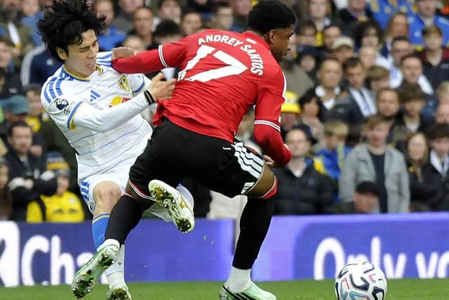 Ao Tanaka battles with Andrey Santos in midfield.