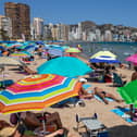 Tourists fill the Levante beach in Benidorm. Photo: Getty Images