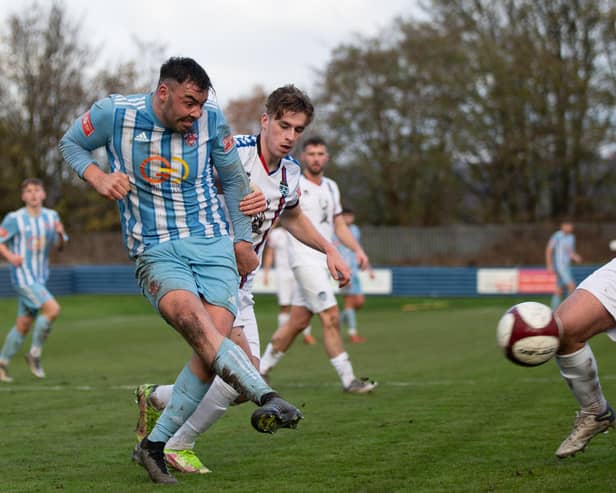 Joseph Walton gets a shot in during Liversedge FC's Northern Premier League defeat to Whitby Town.