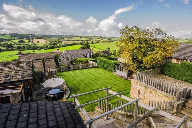 Views of hills and valleys can be enjoyed from the seating areas in the garden.