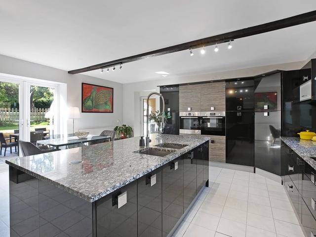 This well equipped kitchen diner has access to an outdoor patio.