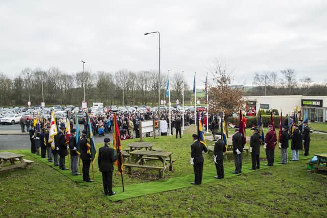 People gather in 2017 at Hartshead Moor services to remember those who died in the coach bomb on the M62 on February 4, 1974.