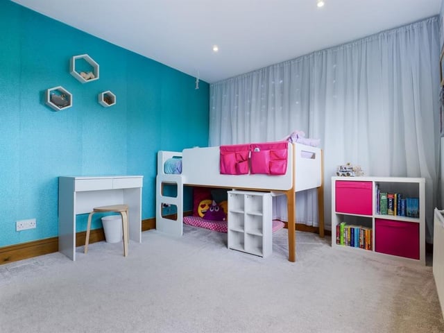 There is plenty of available floor space in this and the other bedrooms.