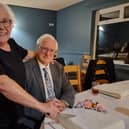 John, right, and Irene Murgatroyd cut the cake at their 60th wedding anniversary celebration.