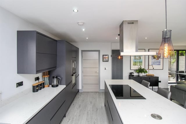 Kitchen all and base units are soft close, with Quartz worktops, and a raft of integrated appliances. Island bars feature a five ring touch screen induction hob, and units and drawers, with a pop out USB. Bi-fold doors open to a balustrade balcony with a lovely outlook.
