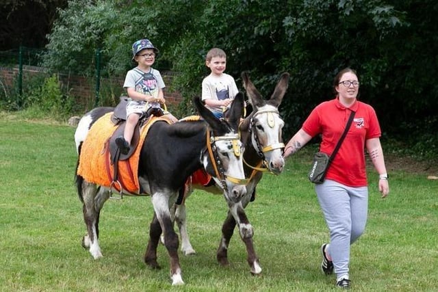 1. Crowlees Junior School celebrated its 50th birthday with a family fun day. Pictured are Gabriel and Kaleb riding donkeys.