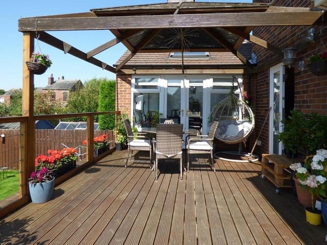 The raised area of decking with a pagoda.