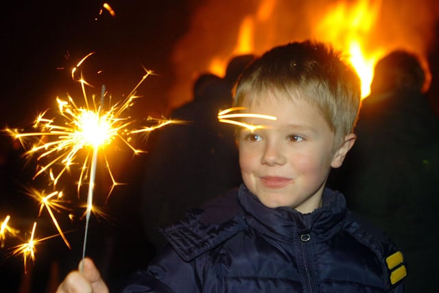 Eight year old Caleb Bates gets to grips with one of his sparklers in 2018.