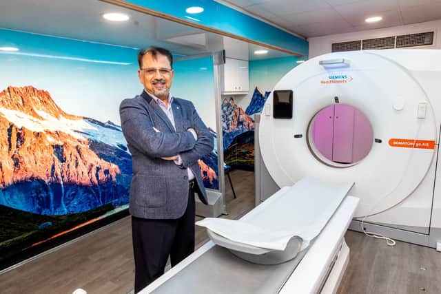 Dr Khalid Naeem, GP and chair of Kirklees clinical and professional forum, inside the mobile CT scanner.