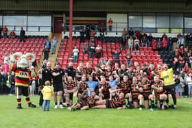 Dewsbury Rams players and staff celebrate winning the League One title