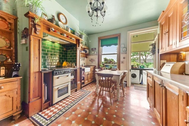 Shaker-style hand-made wooden units and a Stoves double oven feature within the dining kitchen.