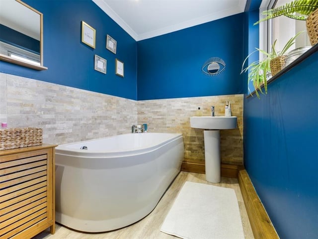 A super size bath is a feature in this house bathroom.