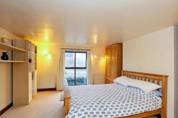 Individually styled bedrooms include a master suite with dressing room and shower room.