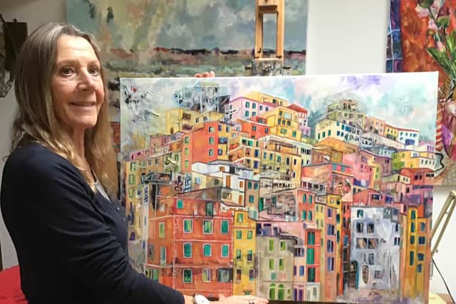 Artist Josie Barraclough with some of her new paintings