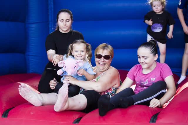 Sophie Shepley, lucie Shepley, Amanda Mann and Katie Shepley enjoying the bouncy castle.