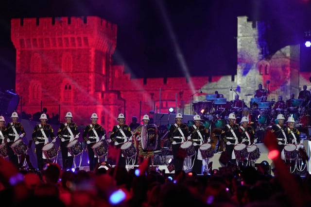 The Band of His Majesty's Royal Marines performs inside the Windsor Castle grounds during the Coronation Concert (Photo by Kin Cheung/POOL/AFP via Getty Images)