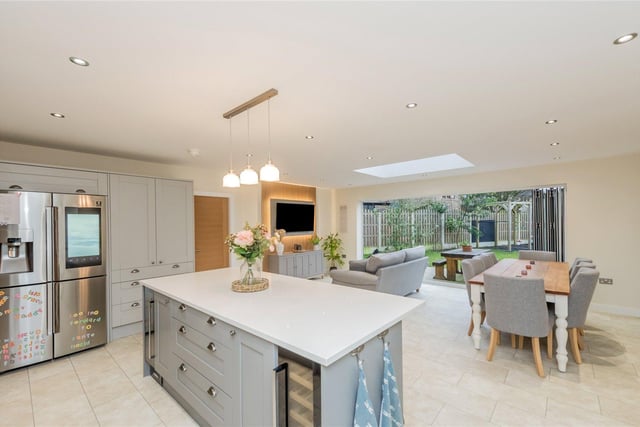 The open plan living and dining kitchen has bi-fold doors out to the garden.