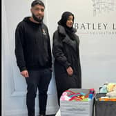 Hassnain Sajjad from Batley Law, right, with two volunteers from Aspire2Inspire getting ready to give away a collection of the toys