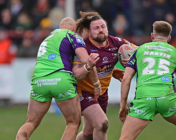 Batley's Michael Ward is tackled. Photo by Paul Butterfield.