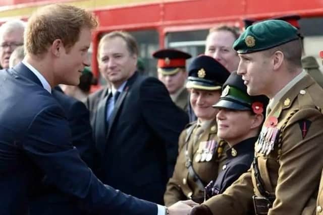 Captain Matthew Totton meeting Prince Harry.