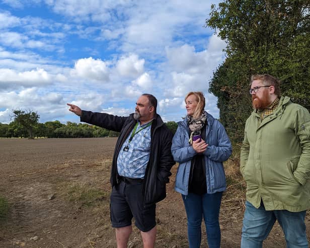 Coun Matt Edwards, right, with members of the Save Our Spen group at the site of a proposed Amazon warehouse in Scholes, near Cleckheaton