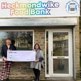 Ricky Newton, Morrisons Community Champion, presenting the donation of £3,000 to Paula Graham of Heckmondwike Food Bank.