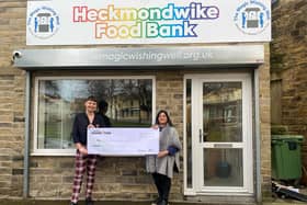 Ricky Newton, Morrisons Community Champion, presenting the donation of £3,000 to Paula Graham of Heckmondwike Food Bank.